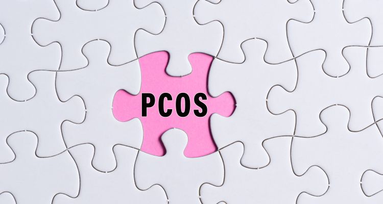 Puzzle pieces with PCOS in the center in place of a missing piece.