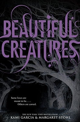 'Beautiful Creatures' by Kami Garcia and Margaret Stohl book cover with the title written in swirling purple font and gray trees in the background.