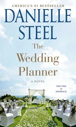 'The Wedding Planner' book cover showing an aisle-view of an outdoor wedding ceremony.
