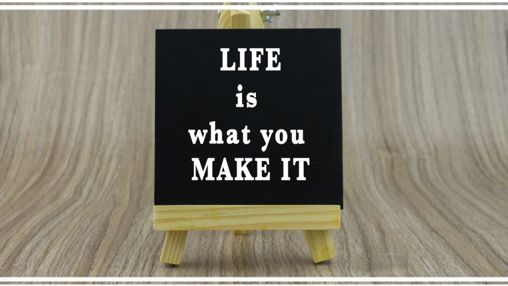 sign that says "life is what you make it"