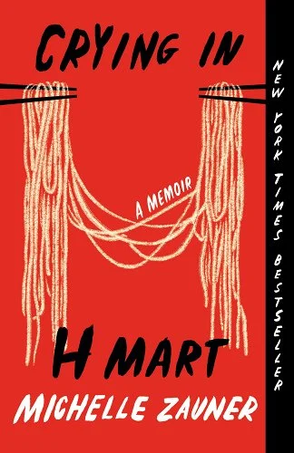 'Crying in H Mart' by Michelle Zauner book cover with two sets of chopsticks holding up noodles