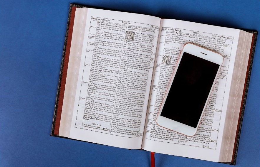 A phone resting on an open book