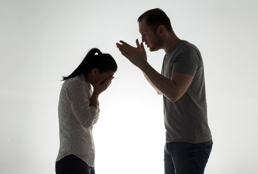 A man yelling at a woman