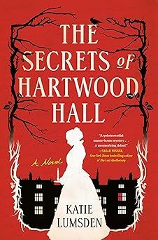 Red background, black and white silhouette of bare trees, a Victorian cityscape, and a sideview of a woman in a Victorian style dress. The cover says the title is The Secrets of Hartwood Hall: A Novel by Katie Lumsden.