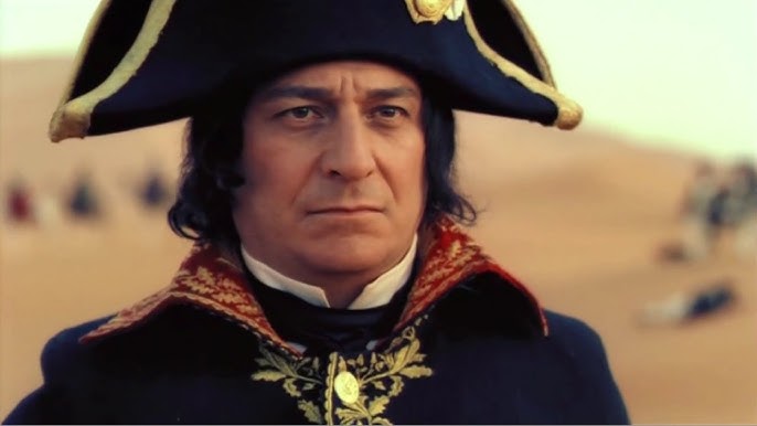 Napoleon from 'Napoléon' miniseries staring pensively.