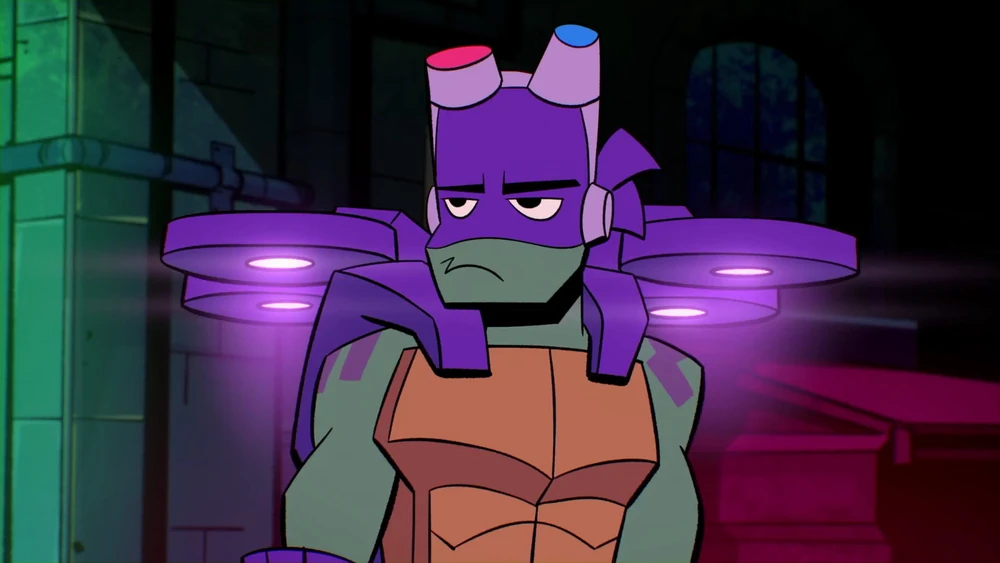 Donatello from "Rise of the Teenage Mutant Ninja Turtle." Image shows Donnie hovering using his battle shell, looking annoyed as something off screen.