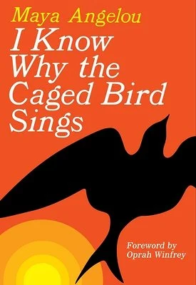 The cover for "I Know Why the Caged Bird Sings." A bright orange background with a black outline of a bird.