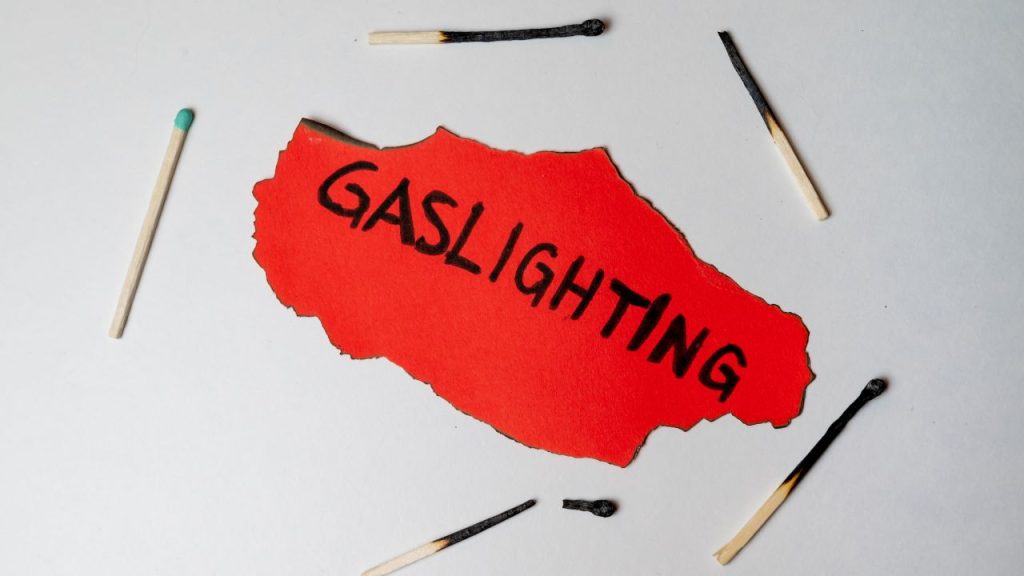 Matchsticks surrounding the word 'gaslighting'.