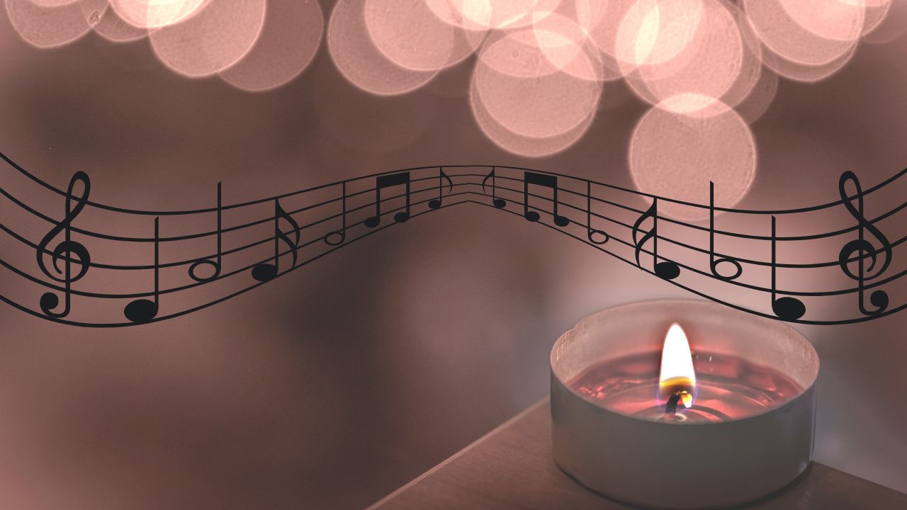The featured image presents a lit teacup candle, musical notes crossing horizontally and blurred out lights on top.
