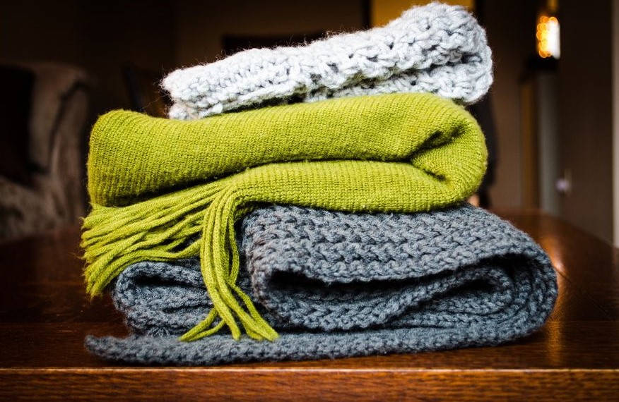Three crocheted blankets stacked on top of each other