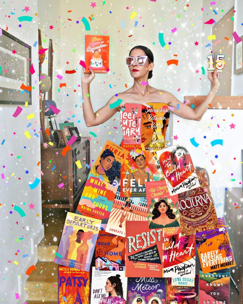 Carmen wearing a dress made of book covers wearing sunglasses and holding a book and the number 15