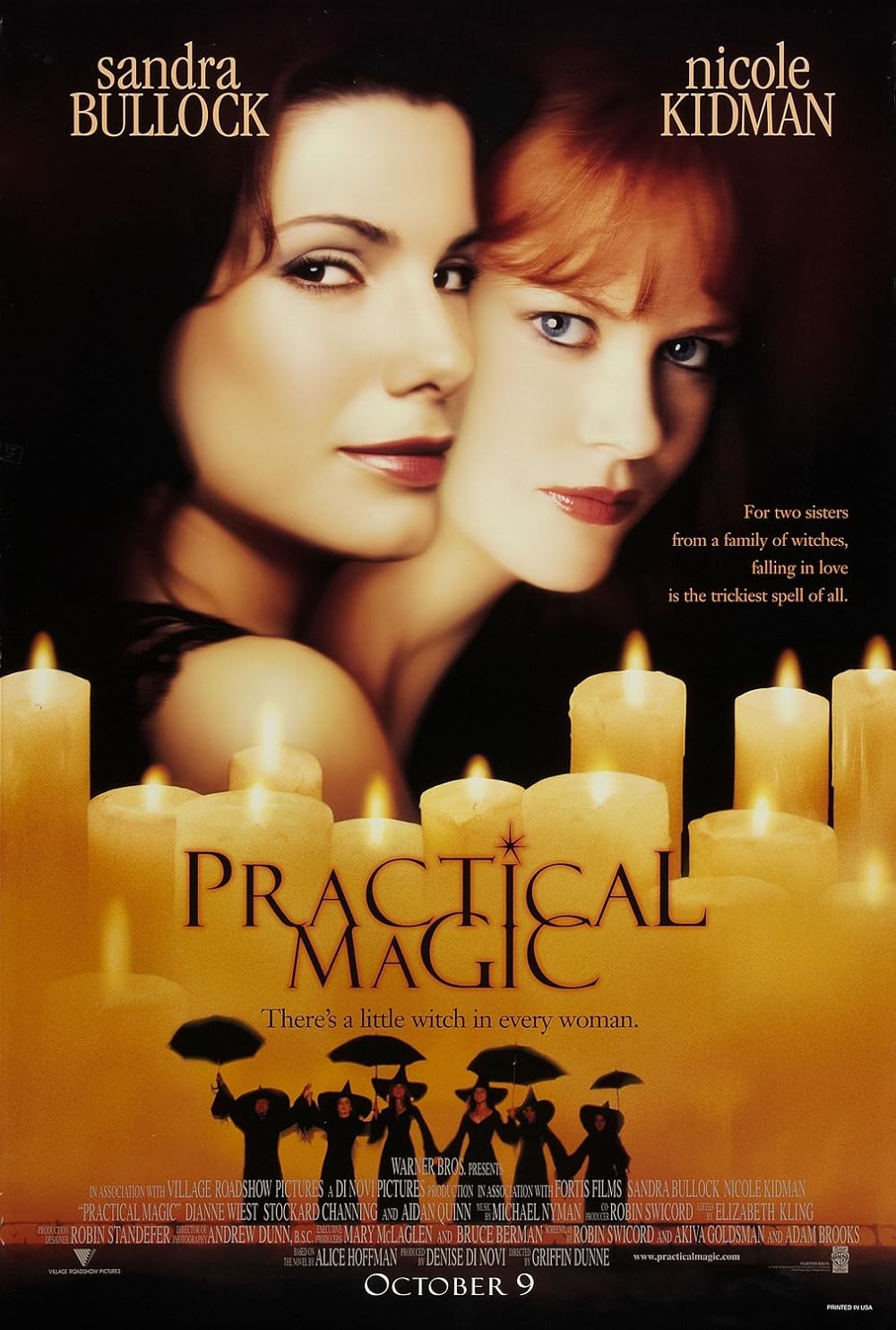Faces of Sandra Bullock and Nicole Kidman stand out against a dark background, illuminated by glowing candles. Small witch figurines holding umbrellas are arranged at the bottom, creating a mysterious, magical atmosphere.