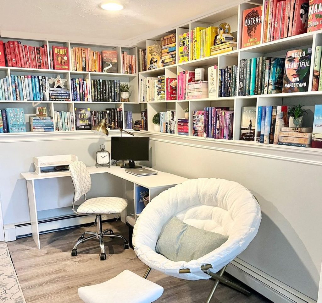 Michelle's reading nook with tons of colorful books lining the shelves.