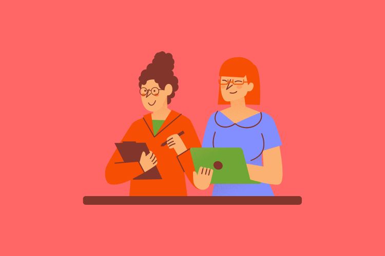 Two girls working together on a project.