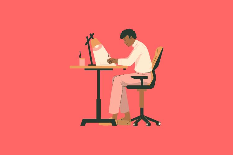 A boy sitting at a desk while working