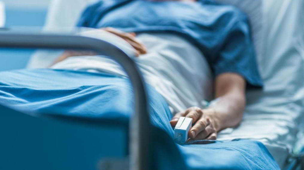 Someone lying in a hospital bed
