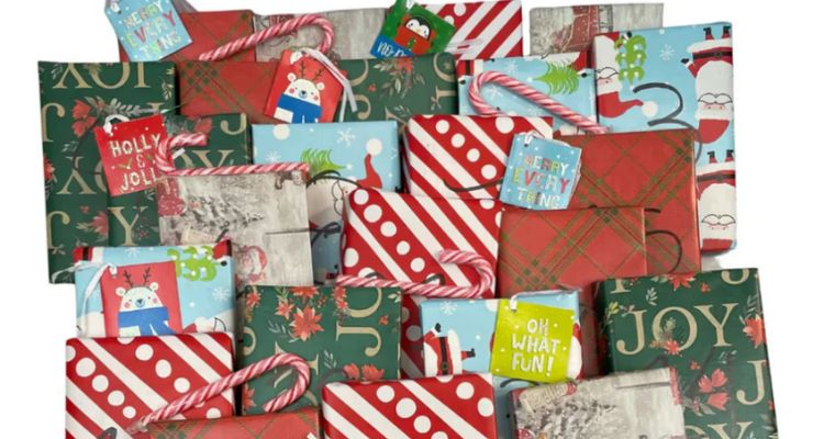 Differently colored wrapped presents with numbers written on them in big, black ink, with differently colored gift tags and red and white candy canes atop the gifts.