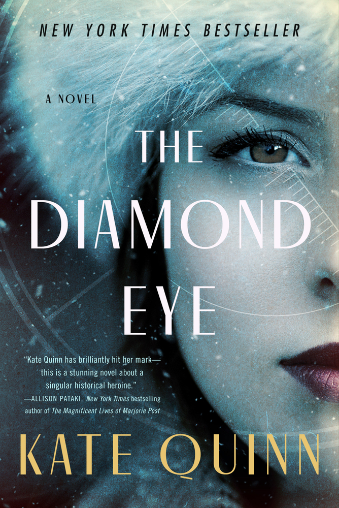 White text reads "The Diamond Eye" over a close-up image of half the face of a young white woman with brown eyes and red lips dressed in a coat and furry hat. A translucent outline of a target surrounds the woman's eye. Above the image is black text that reads "New York Times Bestseller," and below the image is yellow text that reads "Kate Quinn."