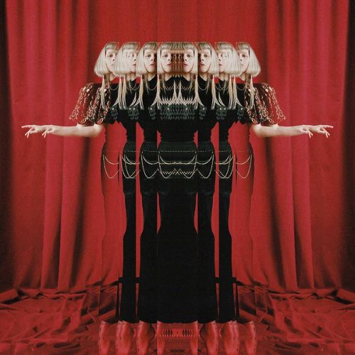 The Gods We Can Touch by AURORA album cover. An optical illusion multiplies and distorts the image of a young white woman with blonde hair in a black and silver dress over a red curtain background.
