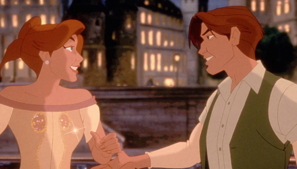 Anya and Dimitri smiling at each other, enamored, against a background of buildings with lit windows.