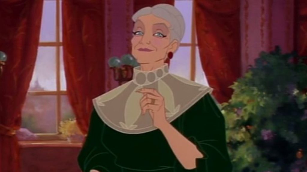 Anastasia's Dowager Empress giving a knowing smirk in a room with red curtains.
