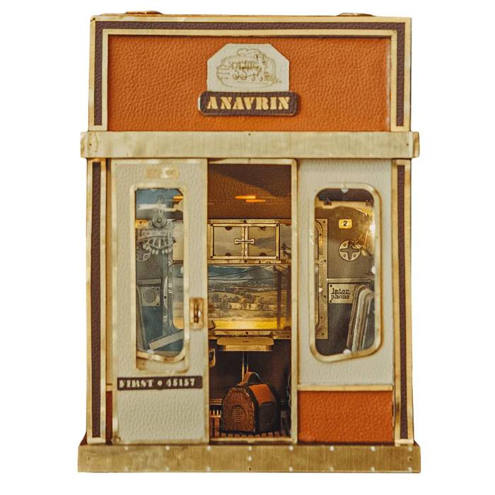 A miniature display featuring subway car with doors, seats, and luggage.