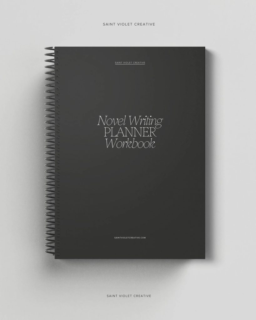 A dark gray spiral notebook against a lighter gray background.