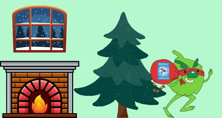 A bare Christmas tree standing next to a fireplace and a snowy window. A green little creature running away with a red sac that has the Mockingjay book cover by Suzanne Collins on the front of it.