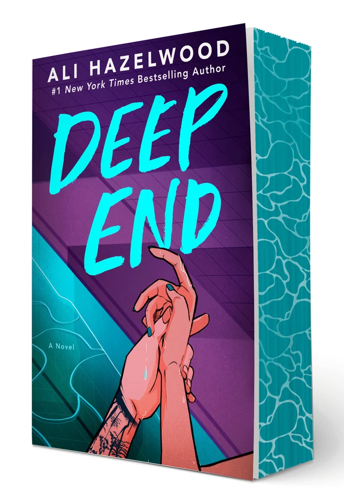 A book with blue painted edges shows two hand intertwined.