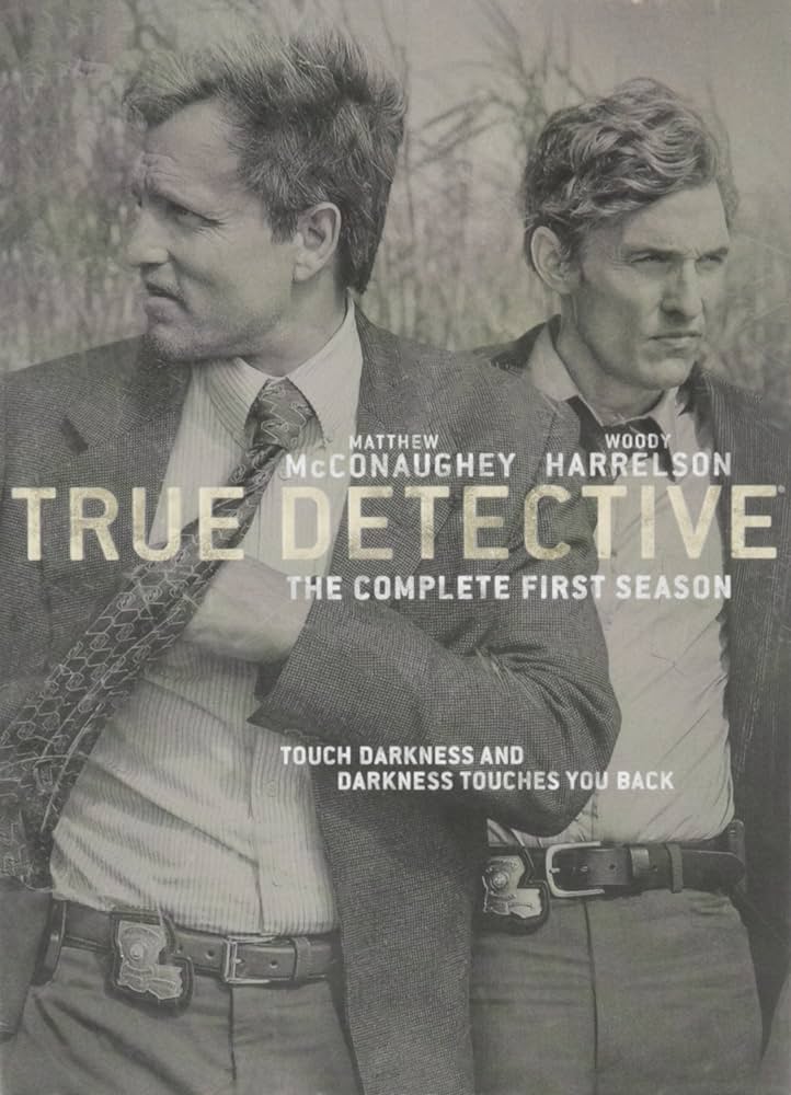 "True Detective" poster of the complete season 1 collection. The image is monotone with both detectives Rustin and Marty in a field.