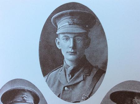 Photograph image of Leonard Ewbank in his military uniform with a cut-off of other soldiers. The photograph is tinted with the color light blue.