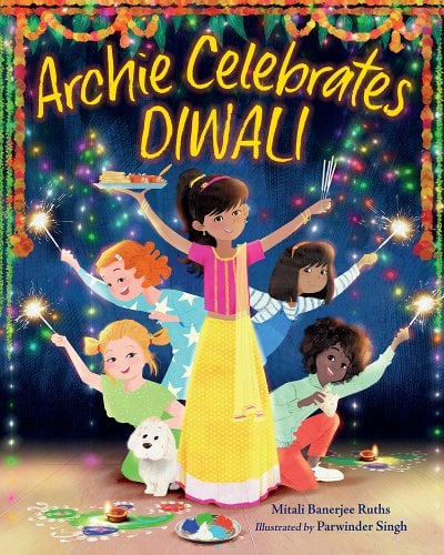 Archie Celebrates Diwali by Mitali Banerjee Ruths, book cover. A young girl is dressed in traditional Indian clothing, holding one hand high with her cultural food and the other hand high also with hand-held sparks. Her friends and her dog are behind her peeking from each side holding lit hand-held sparks. Floral decorations hang above all of them for their celebration.