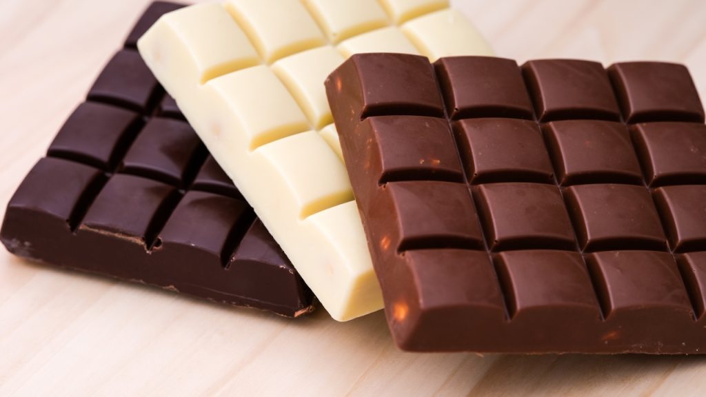 Three Chocolate Bars; White, Dark, and MIlk.