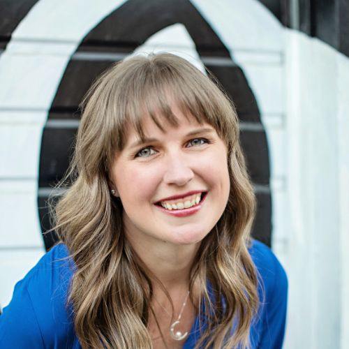 Marissa Meyer smiling candidly outside