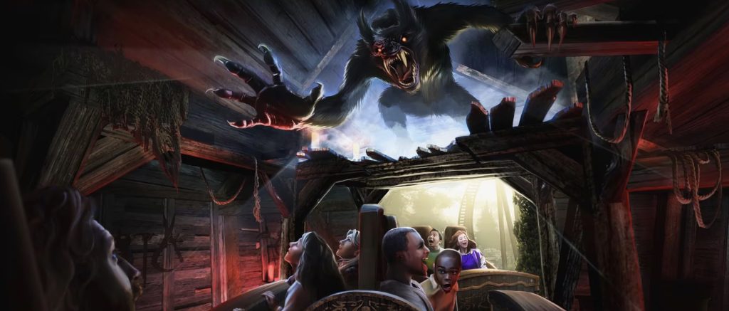 An artist rendering of people on a coaster that is about to go outside of a wooden shed. A werewolf lunges at them from above the entrance.