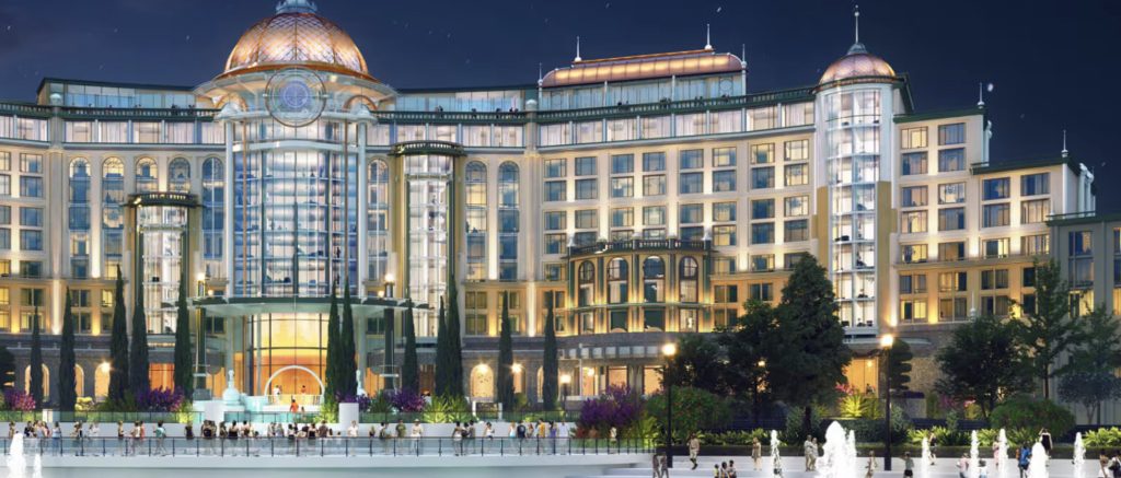 An artist rendering of the front of an extravagant glass hotel.