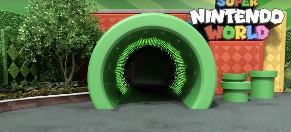 Red and yellow blocks surround a green tube tunnel with lights on the inside.