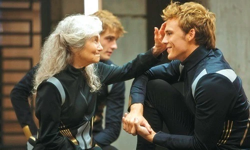 Mags gently touching the side of Finnick's head