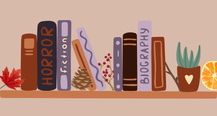 Bookshelf with books, an orange slice, a twig, a pine cone, and a leaf.
