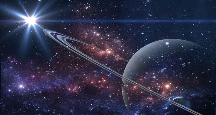 Saturn is positioned diagonally in the lower left-hand corner. It's surrounded by stars in the galaxy, and the sun is shining brightly in the top right-hand corner.
