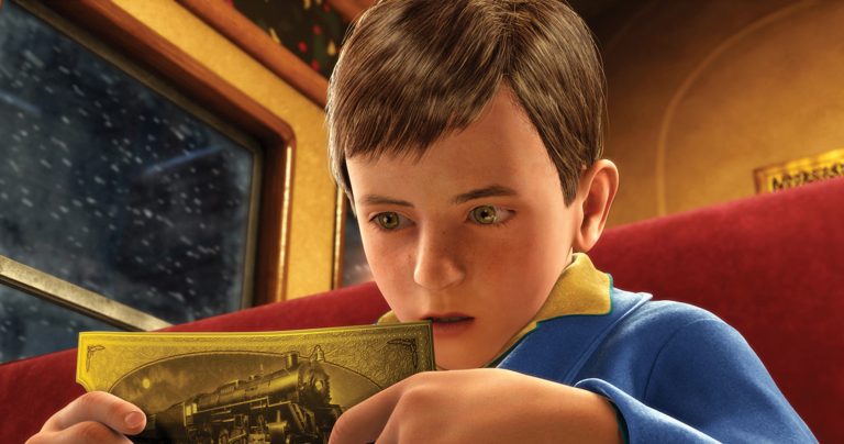 The main boy staring at his golden ticket for the train.