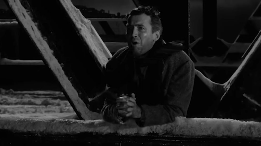 George stands on the bridge and pleads for the man to come back and return him to his life before granting his wish.