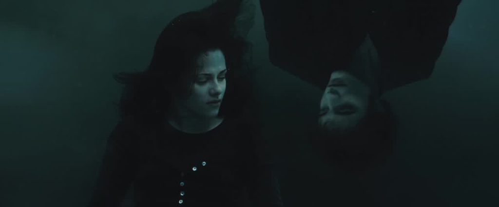 Bella sinking into murky water and a vision of Edward next to her