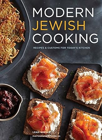 Book cover for the Modern Jewish Cooking cookbook, featuring an image of traditional dishes.