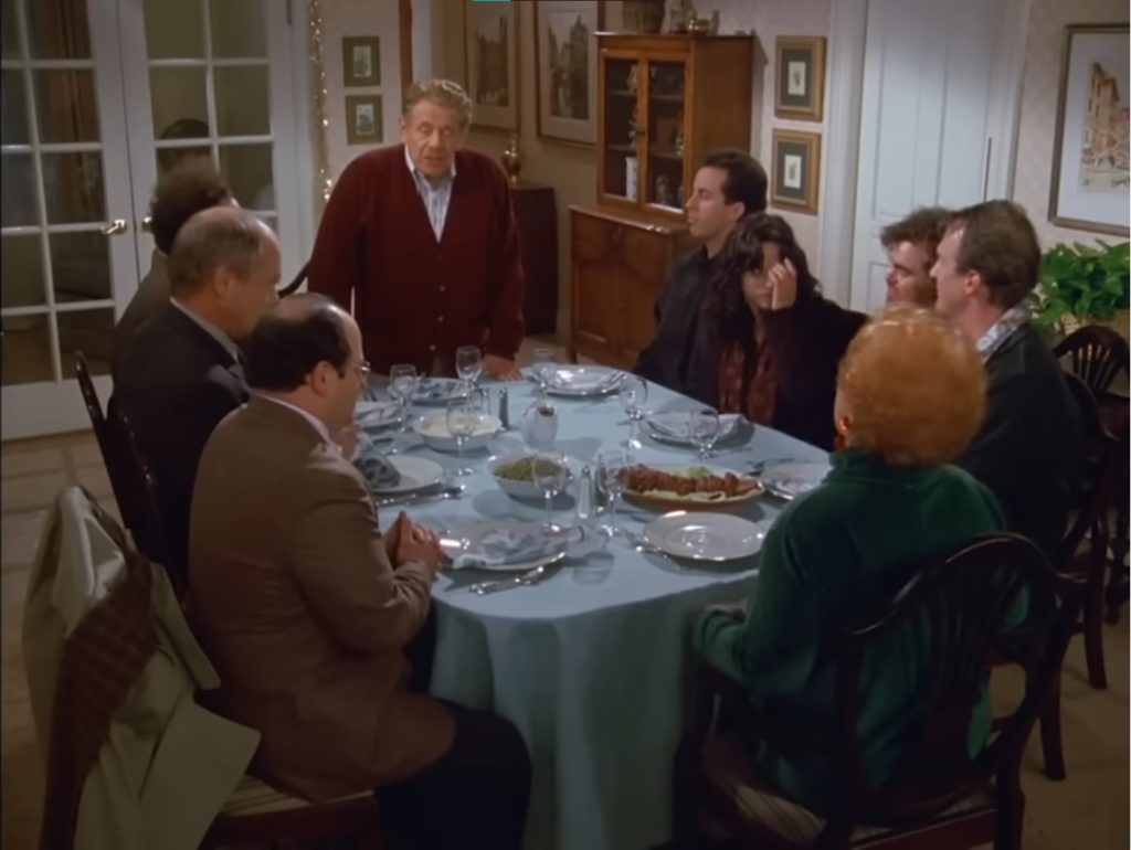 The Costanza family and friends of the family sit down at the dinner table. Frank leads the "Airing of Grievances."
