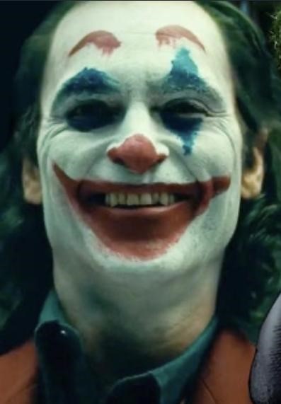 Picture of the character The Joker smiling wearing clown makeup