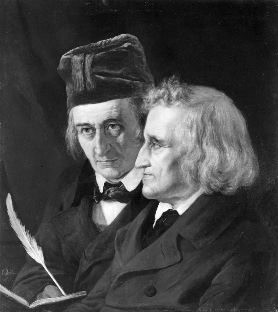 An old photograph of Jacob and Wilhelm Grimm with one holding a quill and book.