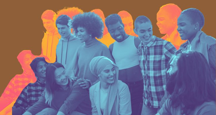 A group of diverse people smile and talk to each other.