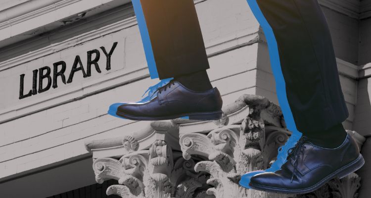 Two legs in men's Oxfords scaling up in front of a library background.
