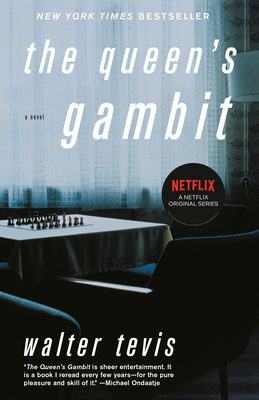 A table is set with a chess game for the cover art of The Queen's Gambit.